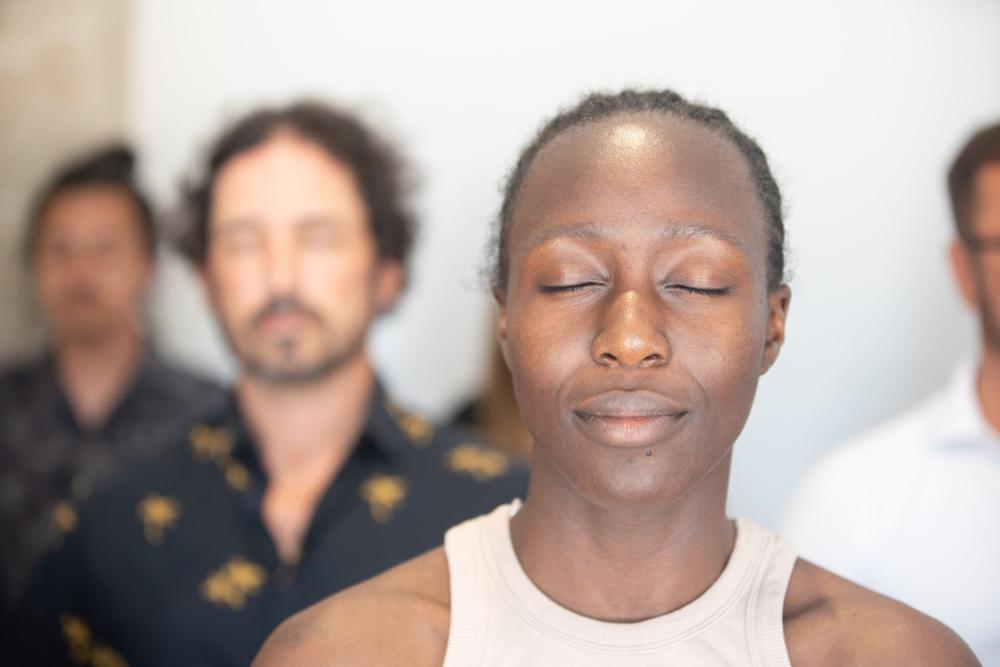woman meditating in a class